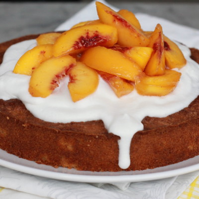 almond cake with poached peaches and coconut cream