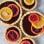 bittersweet chocolate truffle tart with candied oranges
