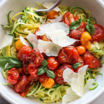 warm smashed tomatoes with zucchini noodles, olive oil and parmesan